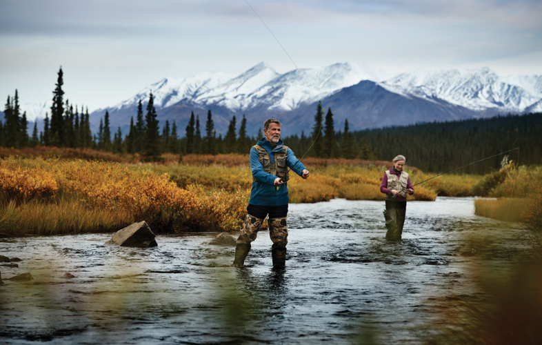 Couple fly-fishing near Denali National Park